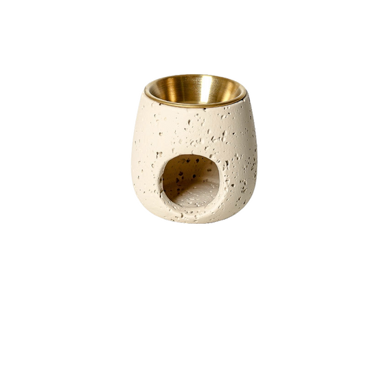 VibraMist Ember Vessel cement fragrance warmer in pale apricot, with a textured finish, gold-tone bowl, and round tealight opening.
