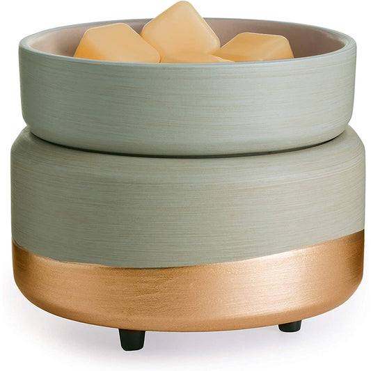 VibraMist Golden Sage fragrance warmer with a soft sage-green finish, metallic gold base, and matching dish holding yellow wax melts.